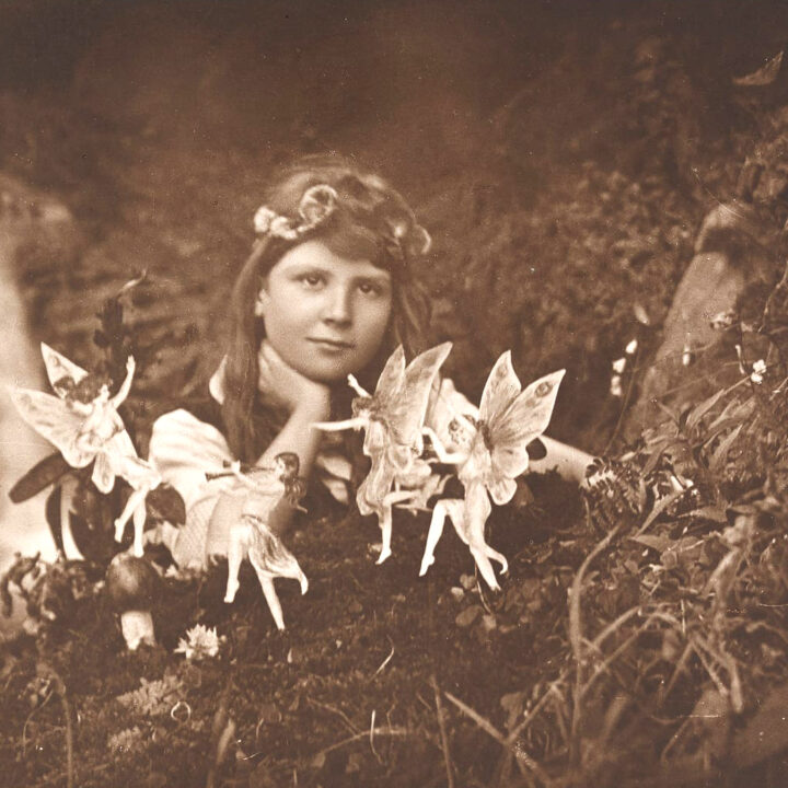 Alice and the Fairies ~ Cottingley Fairy Photograph, by Frances Griffiths and Elsie Wright, silver print on matte paper mounted to thin brown board, miniature print of 1917 original c. 1920