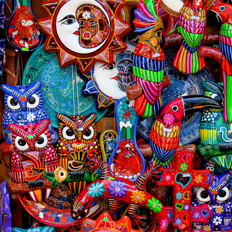 colorful mural featuring crescent moon, owls and fish