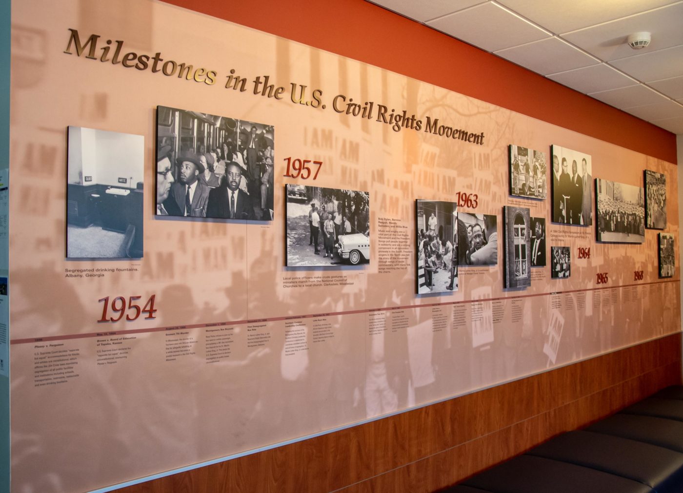 Milestones in the U.S. Civil Rights Movement exhibit wall with historical photographs and timeline