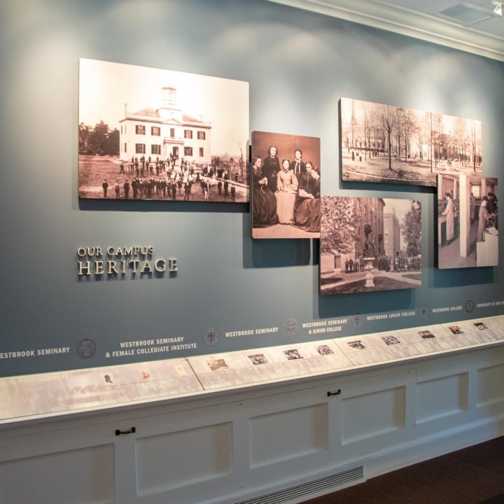 Our Campus Heritage exhibit wall with historical photos and timeline